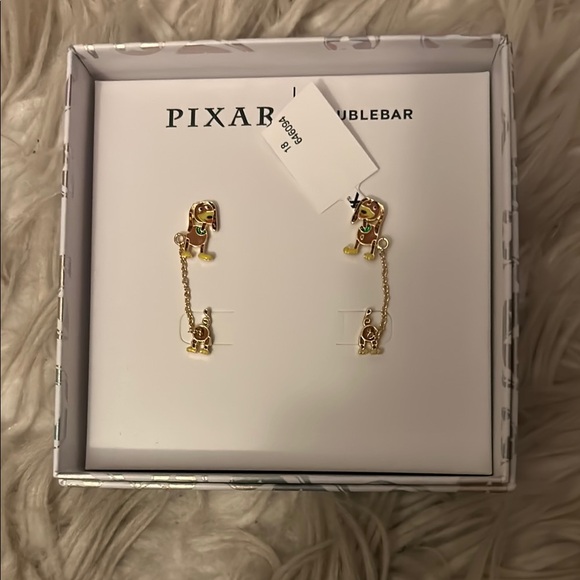 BaubleBar Jewelry - New in box Toy Story Pixar Slinky baublebar earrings